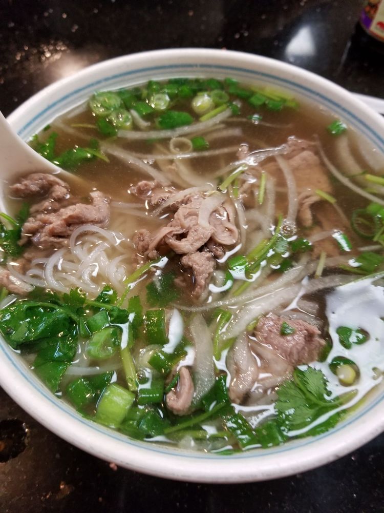 Pho with rare and well-done beef and green onion