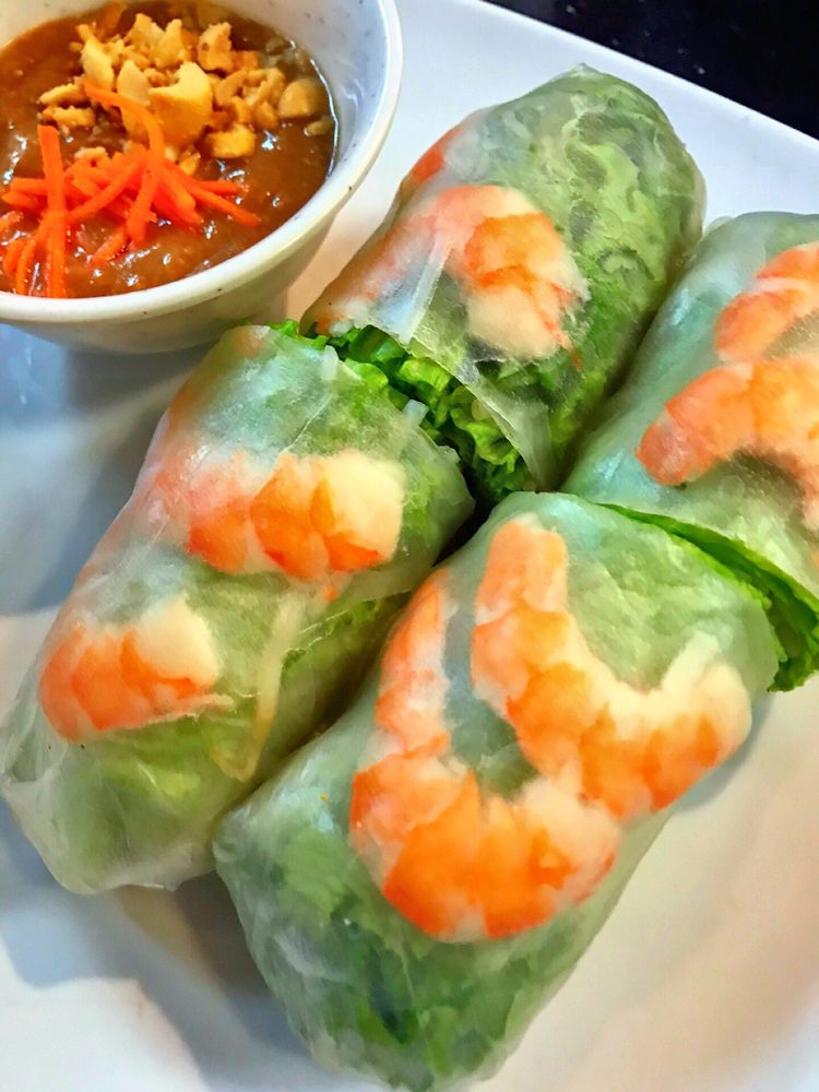 Fresh spring rolls with shrimp and a side of pickled carrot